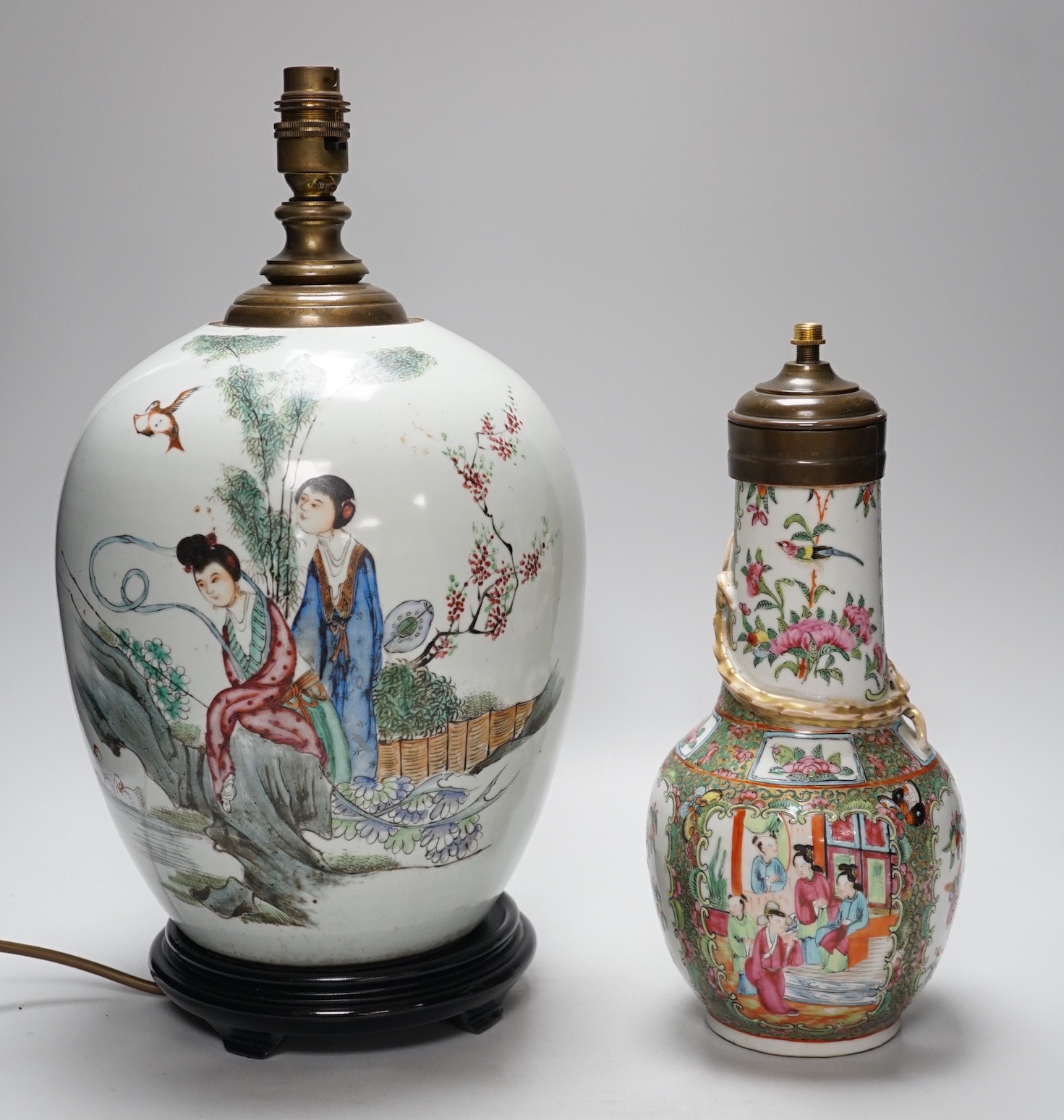 A Chinese famille rose vase converted to a lamp, 26cm, and a larger Chinese vase/lamp base, on stand, 41cm high